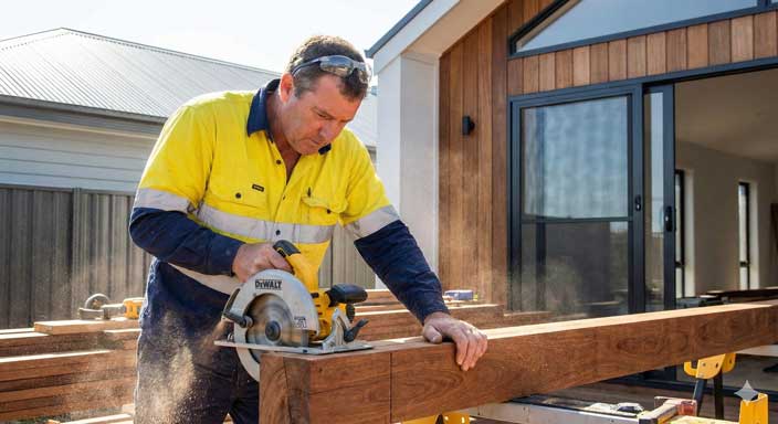 Carpenter using automated quoting and job cards to eliminate paperwork